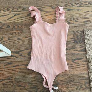 Francesca’s Baby Pink Ruffle Bodysuit